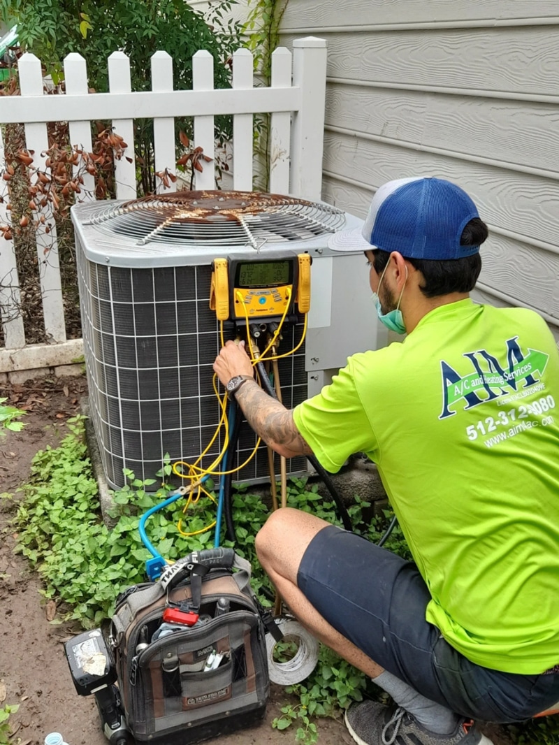 hvac being serviced for cooling repair by AIM A/C and Heating Services