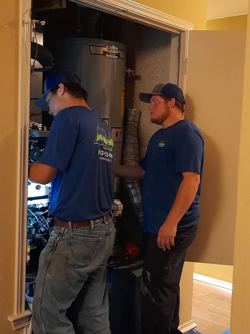 HVAC system being serviced for air conditioning repair by AIM A/C and Heating Services technicians