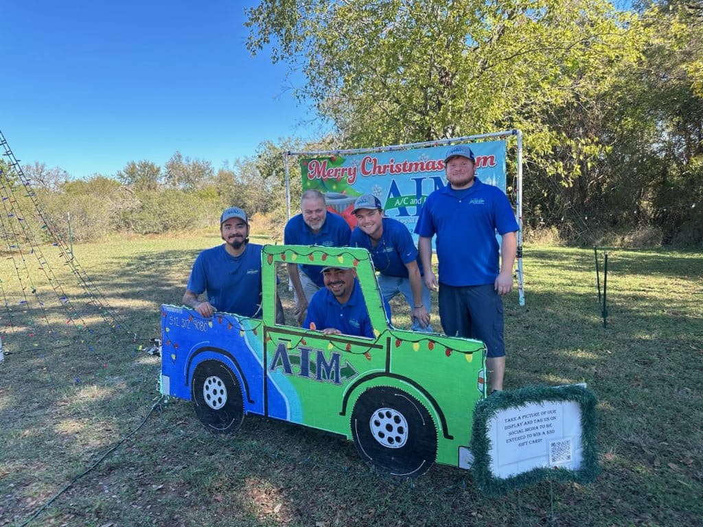 2024 aim ac and heating services team photo at the buda trail of lights