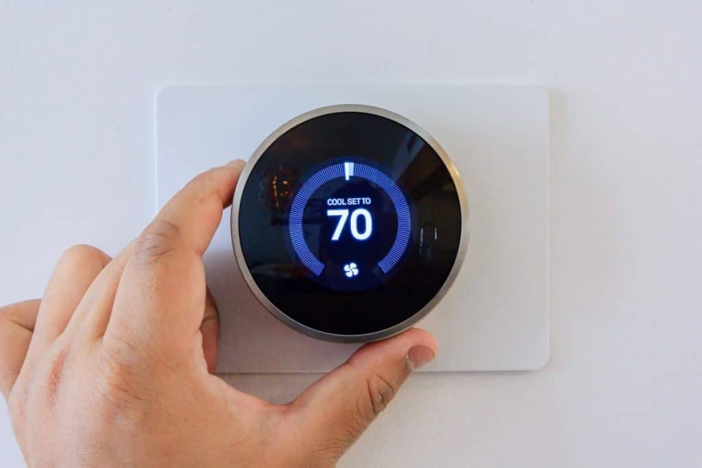 handing adjusting a smart thermostat to a cooler temperature